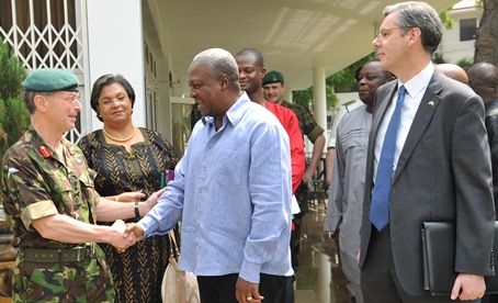President Mahama in a handshake with Gen Sir David Richards, CDS of the United Kingdom at the President's residence in Accra. With them is Madam Hannah Tetteh, Minister of Foreign Affairs of Ghana